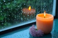 Monsoon serenity flame burning aroma candle by rain streaked window