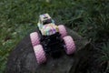 Monster car toys standing on stone and grass