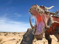 Monster dragon on desert close up with copy space