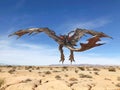 Monster dragon on desert is taking off rear view