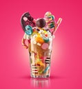 Monster shake, freak caramel shake . Colourful, festive milk shake cocktail with sweets, jelly. Colored caramel