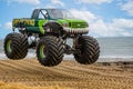 Monster truck airborne at the beach in Bournemouth, Dorset, UK Royalty Free Stock Photo