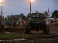 Monster truck covered in mud near a mud pit at a mud bog in Georgia Royalty Free Stock Photo