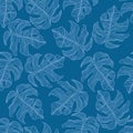 Monstera leaf shapes seamless random pattern. Creative flora print with bright navy blue indigo backround Royalty Free Stock Photo