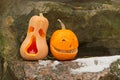 Monsters carved from pumpkins on a stone wall, Halloween. Royalty Free Stock Photo