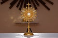 A monstrance on a altar during an adoration.