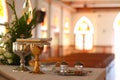 Monstrance and liturgical vessels in church background