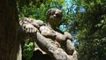 Monstrous sculpture Hercules who cuts Caco at the Park of the Monsters of Bomarzo, natural park adorned with numerous basalt scul