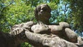 Monstrous sculpture Hercules who cuts Caco at the Park of the Monsters of Bomarzo, natural park adorned with numerous basalt sculp