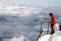 Mountaineer watching clouds at Gouter Mountain House