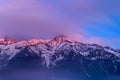 The Mont Blanc Massif below the moving clouds in Europe, France, the Alps, towards Chamonix, in summer