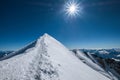 Mont Blanc Monte Bianco snowy 4808m summit wide angle view with surrounded French Alps landscape with deep blue sky and bright