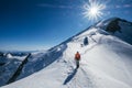 Before Mont Blanc Monte Bianco summit 4808m last ascending. Team roping up Man with climbing axe dressed high altitude