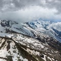 Mont Blanc rocky mountain massif overcast summer view from Aiguille du Midi Cable Car, Chamonix, French Alps Royalty Free Stock Photo