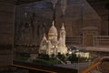 A miniature replica model of the Montmarte Basilica is displayed inside the church