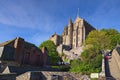 Scenic landscape view of ancient Mont Saint Michel abbey against blue sunny sky. Normandy Royalty Free Stock Photo