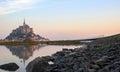 Mont Saint-Michel reflected in water at dawn