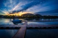 Mont St-Hilaire at sunrise seen from the public marina of Beloeil, with the reflection on the Richelieu River