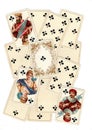 A montage of antique playing cards showing clubs.