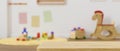 A montage copy space on wooden table over blurred kids playroom background