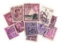 Purple vintage postage stamps from around the world.