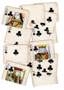A montage of torn halves of vintage playing cards featuring clubs.