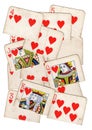 A montage of torn halves of vintage playing cards featuring hearts.