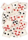 A montage of torn halves of vintage playing cards featuring numbers in all suits.