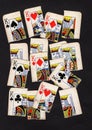 A montage of torn pieces of playing cards featuring kings.