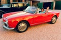 Montagnana, Italy August 27, 2018: Girl driving Retro car Alfa Romeo convertible 1961 ode release.