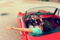 Montagnana, Italy August 27, 2018: Girl driving Retro car Alfa Romeo convertible 1961 ode release.