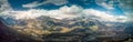Montagne panorama with half snow and big clouds