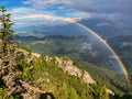 Montain hike on the ridge of Piatra Craiului Mountains with rainbow