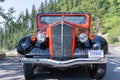 Front view of the classic and historic Red Jammer tour buses along Going to the Sun Road