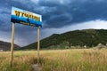 A Wyoming State welcome sign with mountains on the background in Western USA