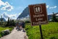 Crowds of hikers gather at the Hidden Lake Trailhead, a very popular easy hike in Logan Pass area of