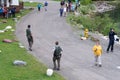 Park rangers step in to move tourists away from a nearby moose, making sure the people don`t get too