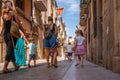 Old street with a family and children in the historic quarter of the antique Spanish village Montblanc.