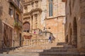 Steps to the church with people in the historic quarter of the antique Spanish village Montblanc.