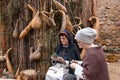 MONTBLANCH, SPAIN - 28 APRIL 2018: Two woman selecting herbs, dressed with medieval clothing at the Montblanc Medieval Week