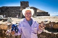 Unknown old man selling mayan mask, at Monte Alban ancient Zapo