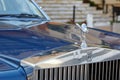 Rolls Royce luxury blue car, silver logo and statue detail in a summer day in Monte Carlo