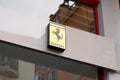 Ferrari logo brand and text sign front facade dealership store sport car italian Royalty Free Stock Photo