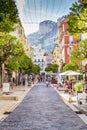 Monte Carlo, Monaco, 10/05/2019: Picturesque street in the city with a cafe. Walking people.