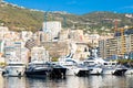 Monte Carlo, Monaco - Port Hercule with luxury yachts, boats, and scenery skyline Royalty Free Stock Photo