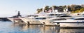 Monte Carlo, Monaco - Port Hercule with luxury yachts, boats, and scenery skyline Royalty Free Stock Photo