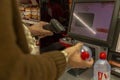 Monte Carlo, Monaco, 10/05/2019: Self-checkout counter in a supermarket. A young man scans purchases