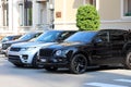 Two Luxurious SUVs Parked In Front Of Monte Carlo Casino In Mona