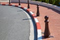 Monte Carlo street curve with formula one red and white signs detail in a summer day in Monte Carlo, Monaco