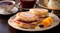 A Monte Cristo English muffin, golden-brown filled with ham, turkey, and Swiss cheese